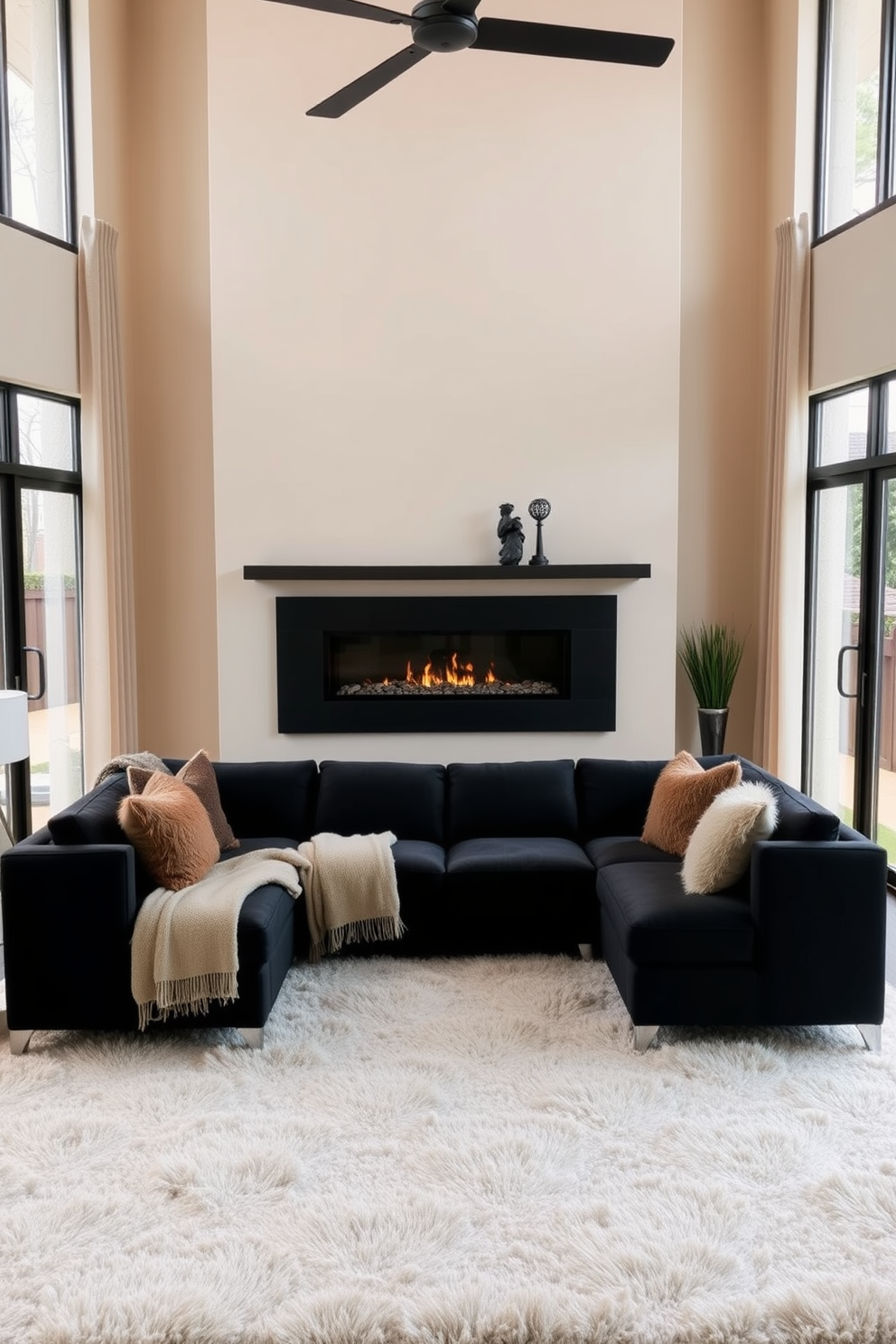 A cozy living room featuring a modern black couch positioned centrally against a soft beige wall. A stylish fireplace is integrated into the design, providing warmth and a focal point, with a sleek mantel adorned with decorative items. The space is accessorized with plush throw pillows in rich textures and a large area rug that adds comfort underfoot. Large windows allow natural light to filter in, enhancing the inviting atmosphere of the room.