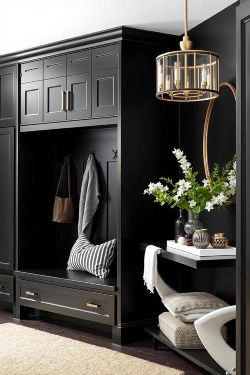 A functional black mudroom features built-in storage solutions including cubbies and hooks for coats and bags. The space is accented with a durable bench and a textured rug that adds warmth to the sleek black cabinetry. In the foyer design, bold black walls create a striking backdrop for minimalist decor. A statement light fixture hangs from the ceiling, illuminating a stylish console table adorned with decorative objects and fresh greenery.