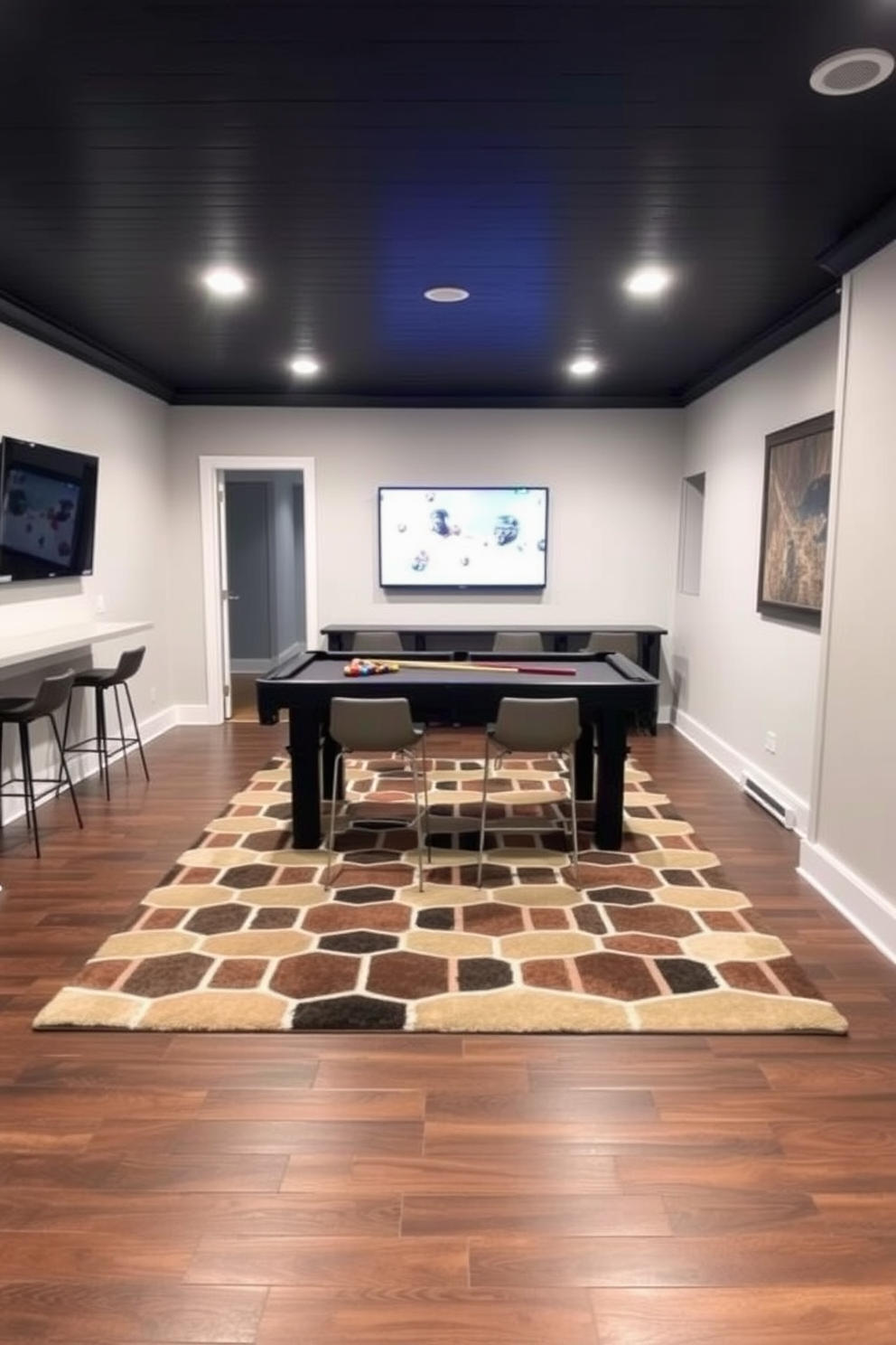 A stylish game room featuring dark wood flooring that enhances the cozy atmosphere. An area rug with a bold geometric pattern is placed centrally, adding a pop of color and comfort to the space. The room is furnished with a sleek black pool table, surrounded by modern bar stools. A wall-mounted flat-screen TV is positioned for optimal viewing, creating an inviting entertainment area.