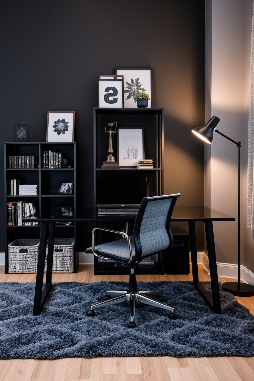 A modern home office featuring layered black and gray textiles creates a cozy yet sophisticated atmosphere. The walls are painted a deep charcoal, and a plush gray area rug anchors the space beneath a sleek black desk. A stylish black office chair with gray upholstery sits at the desk, complemented by a black bookshelf filled with curated decor and books. Ambient lighting from a black floor lamp casts a warm glow, enhancing the inviting feel of the room.