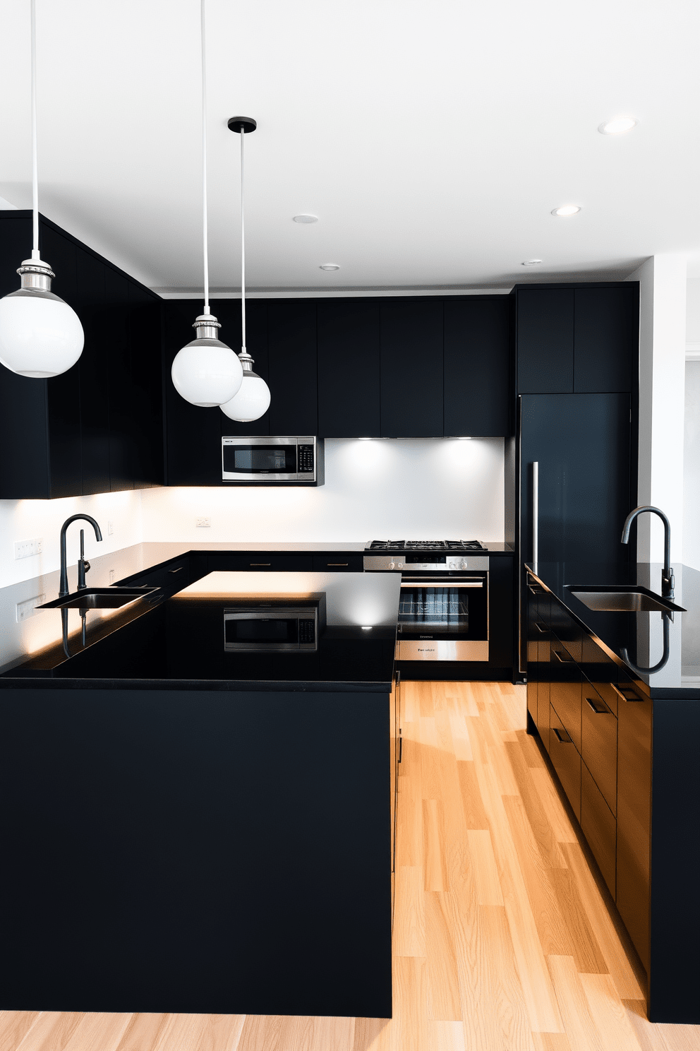 A minimalist black kitchen features sleek cabinetry with a matte finish and a large island in the center. The countertops are made of polished black granite, and the space is illuminated by pendant lights that hang above the island. The walls are painted in a soft white to create contrast, and the flooring is a light wood that adds warmth to the design. Stainless steel appliances are seamlessly integrated into the cabinetry for a cohesive look.