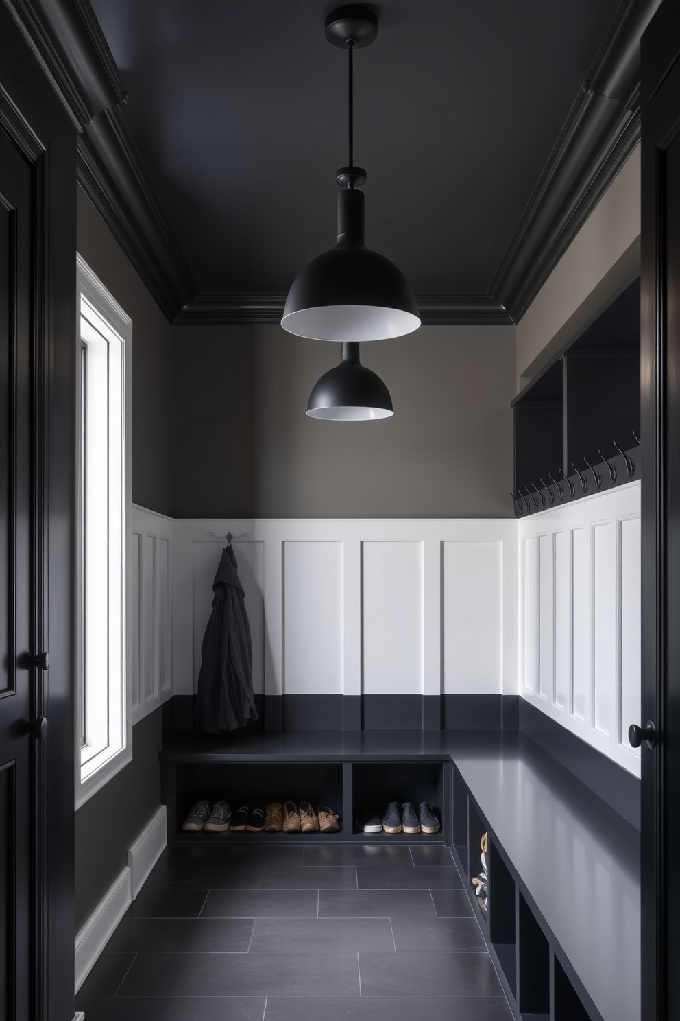 A stylish black mudroom features sleek black pendant lighting fixtures that hang gracefully from the ceiling. The space is designed with built-in benches and cubbies, providing ample storage for shoes and coats while maintaining a modern aesthetic.