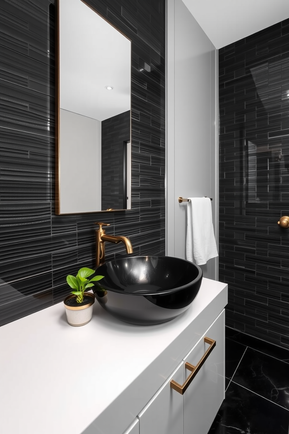 A contemporary black vessel sink sits elegantly atop a sleek white countertop, creating a striking contrast. The walls are adorned with dark, textured tiles, enhancing the room's modern aesthetic while a minimalist mirror reflects the sophisticated design. The floor features polished black tiles that add depth to the space, complemented by stylish brass fixtures. A small potted plant on the countertop introduces a touch of greenery, softening the overall look of the powder room.