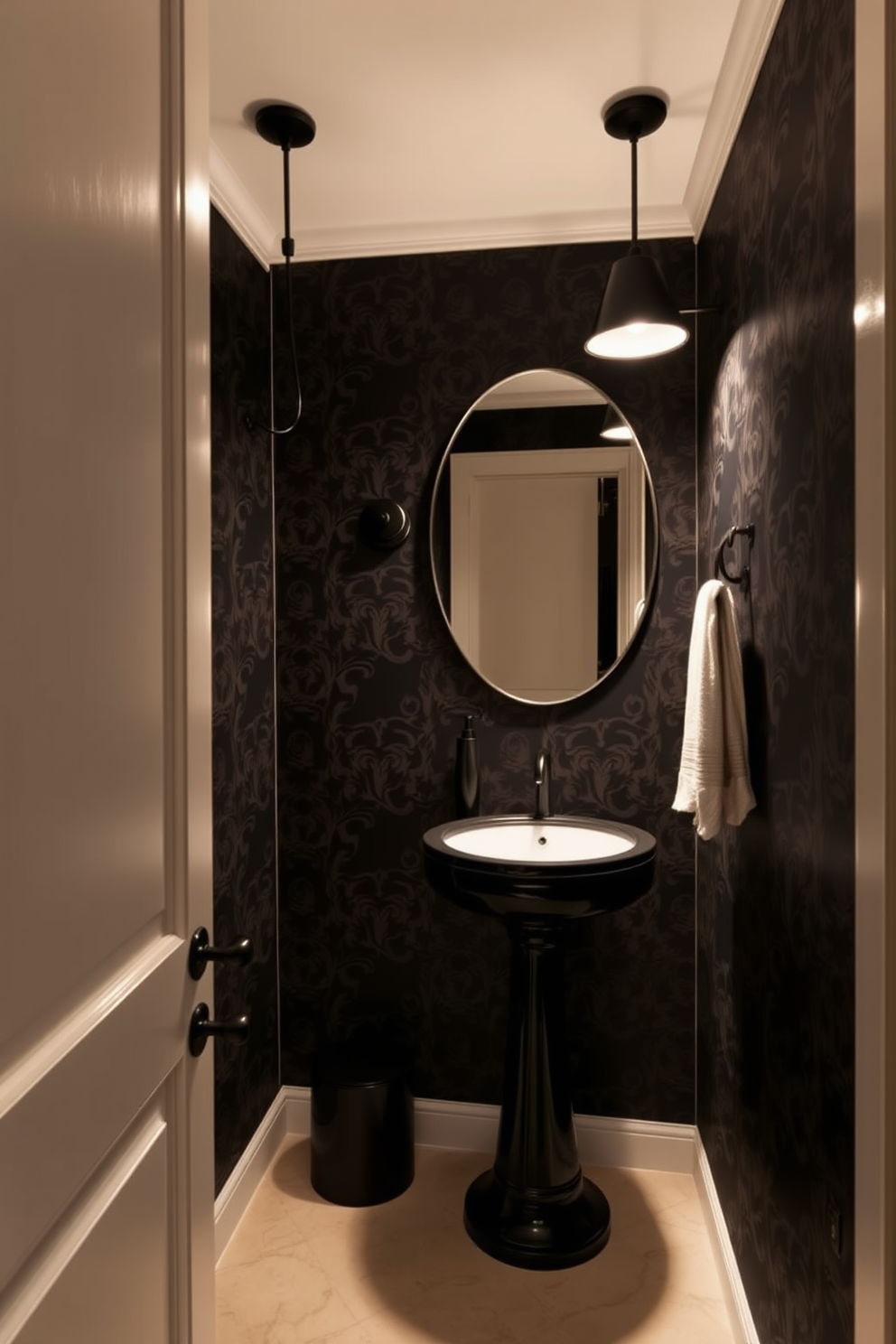 An elegant black powder room features sleek black lighting fixtures that cast a warm glow, enhancing the sophisticated atmosphere. The walls are adorned with rich, dark wallpaper, while a stylish pedestal sink complements the overall design.