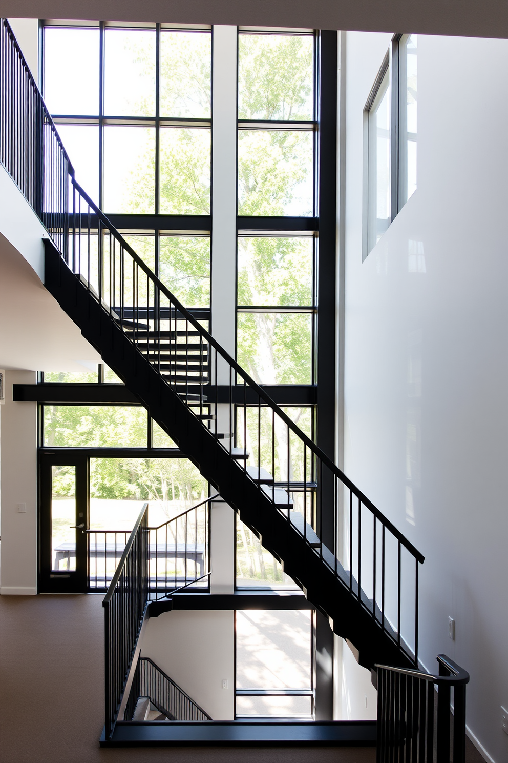 An open concept black staircase elegantly ascends, surrounded by abundant natural light streaming through large windows. The sleek black railing contrasts beautifully with the bright, airy space, creating a striking focal point in the room.