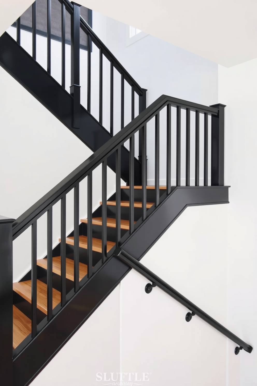 A modern farmhouse black staircase features sleek black railings and wooden treads that add warmth to the design. The walls surrounding the staircase are painted in a soft white, creating a striking contrast that enhances the staircase's bold aesthetic.