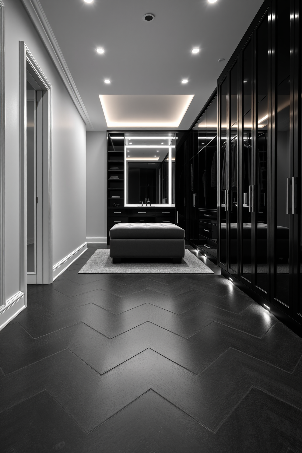 A sophisticated black tile flooring design featuring large matte black tiles arranged in a herringbone pattern. The tiles are complemented by sleek white baseboards and strategically placed LED lighting that highlights the elegant texture of the flooring. For the black walk-in closet design, envision floor-to-ceiling cabinetry with a glossy black finish that reflects light beautifully. The space includes a plush ottoman in the center and an illuminated vanity area with a large mirror, creating a luxurious and functional dressing experience.