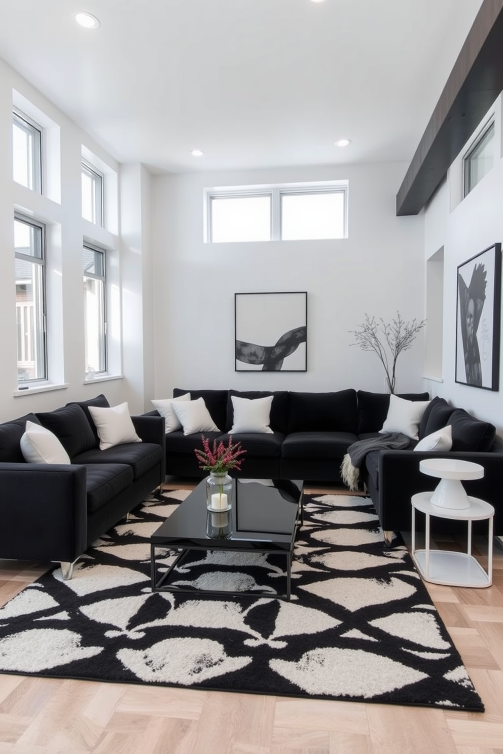 Sleek black furniture is arranged in a modern basement space, featuring a plush black sectional sofa paired with white accent pillows. The walls are painted in a crisp white, contrasting beautifully with the dark furniture, while a geometric black and white rug anchors the seating area. In one corner, a minimalist black coffee table sits atop the rug, surrounded by stylish white side tables. Large windows allow natural light to flood the space, highlighting the contemporary art pieces that adorn the walls.