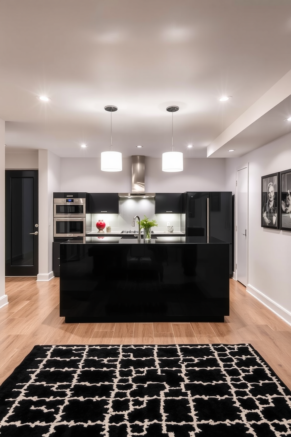 A modern basement space featuring a sleek black island at the center. Above the island, elegant white pendant lights provide a warm glow, contrasting beautifully with the dark cabinetry. The walls are painted in crisp white, complementing the black features throughout the room. A stylish area rug in monochrome patterns adds texture and interest to the floor.