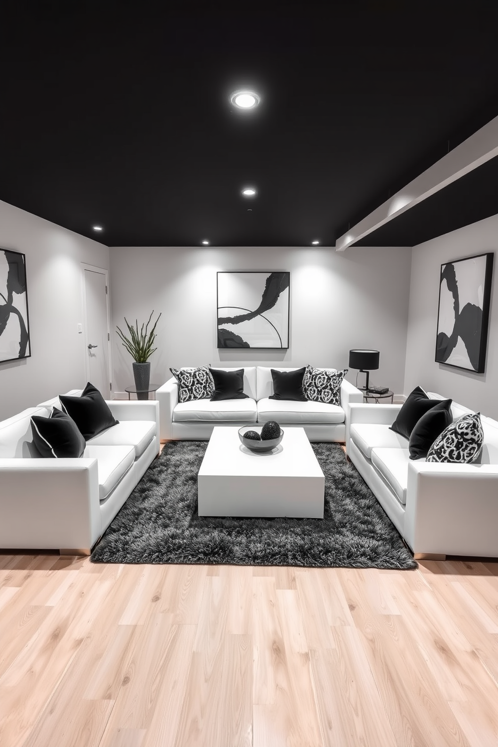 A stylish basement featuring a white sofa complemented by black accent chairs that create a striking contrast. The space is illuminated by soft lighting, enhancing the modern aesthetic of the black and white color scheme. The walls are adorned with abstract black and white artwork, adding visual interest to the minimalist design. A sleek coffee table sits at the center, surrounded by a plush area rug that ties the elements together.