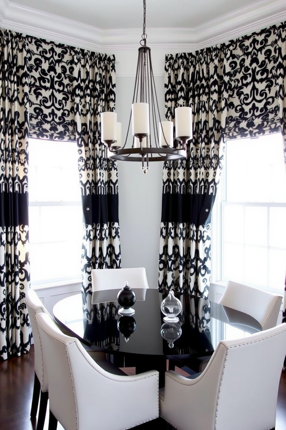 A chic dining room featuring stylish black and white patterned curtains that elegantly frame large windows. The dining table is a sleek black finish with white upholstered chairs, creating a striking contrast in the space. The walls are painted in a soft white, enhancing the boldness of the curtains. A contemporary chandelier hangs above the table, adding a touch of sophistication to the overall design.