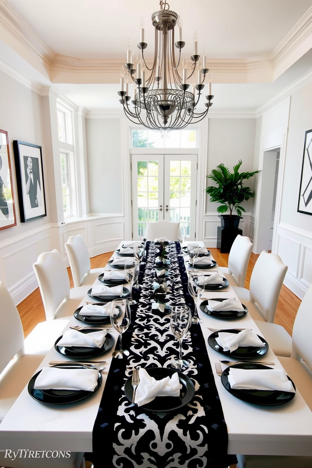 A stylish dining room featuring black and white themed place settings. The table is elegantly set with black plates, white napkins, and silver cutlery, complemented by black and white patterned table runners. The walls are adorned with monochrome artwork, and a striking chandelier hangs above the table. Large windows allow natural light to flood in, enhancing the contrast of the black and white decor.