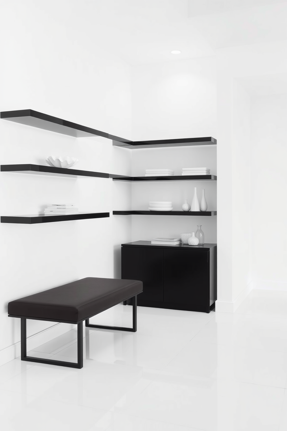 A minimalist foyer features sleek black shelving against a crisp white wall. The shelves are adorned with carefully curated white decor items, creating a striking contrast and a sense of openness. The flooring is a polished white tile that complements the minimalist aesthetic. A simple black bench sits against the wall, providing a functional yet stylish touch to the space.