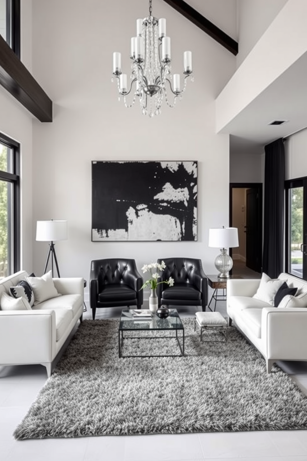 A stylish living room featuring bold black accent chairs paired with a crisp white sofa. The space is illuminated by a modern chandelier hanging from the ceiling, while a large abstract painting adorns the wall behind the sofa. The floor is covered with a plush area rug that ties together the black and white theme. Large windows allow natural light to flood the room, creating a warm and inviting atmosphere.