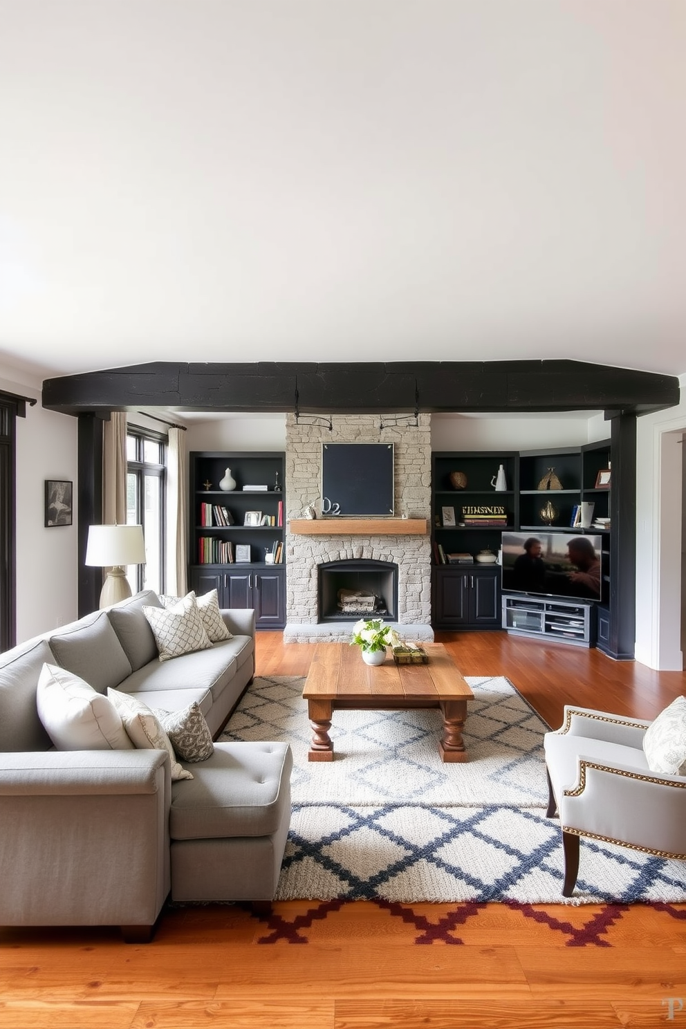 A cozy living room featuring rustic black beams against a crisp white ceiling. The space is adorned with a large sectional sofa in soft gray upholstery and a vintage coffee table made of reclaimed wood. On one side, a stone fireplace serves as a focal point, surrounded by built-in shelves showcasing books and decorative items. The flooring is a warm hardwood, complemented by a plush area rug in black and white geometric patterns.