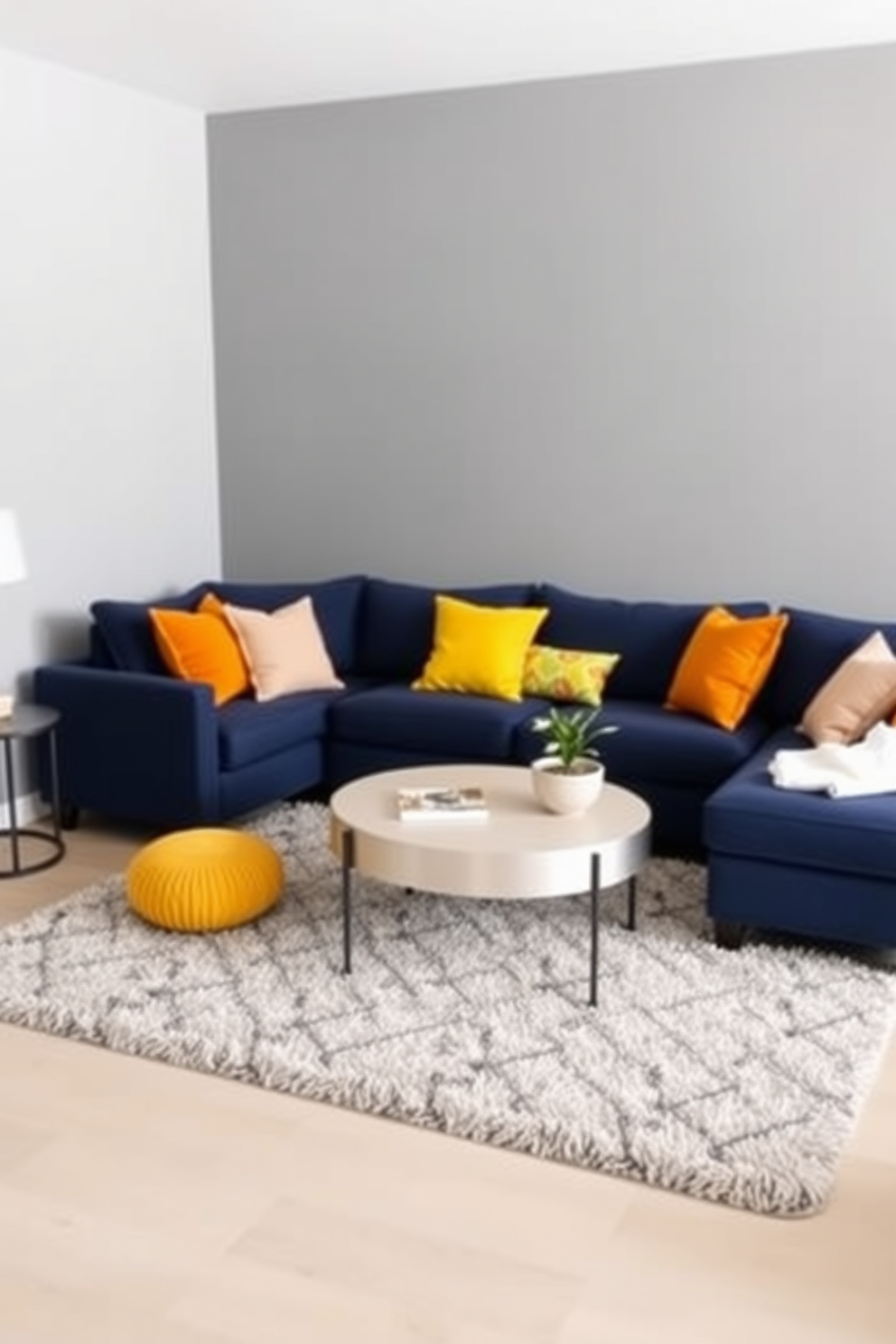 Cozy navy sectional with bright accents. The sectional is complemented by vibrant throw pillows in shades of yellow and orange, creating a warm and inviting atmosphere. The walls are painted in a soft gray, enhancing the cozy feel of the space. A plush area rug in a geometric pattern adds texture and interest to the floor, while a modern coffee table sits at the center.