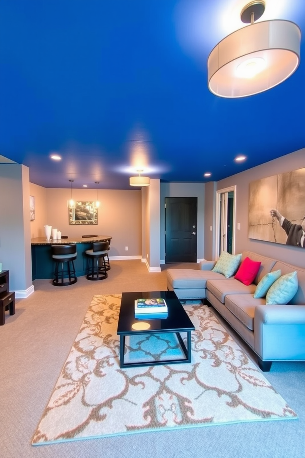 A bright blue ceiling creates a striking focal point in the basement, enhancing the overall ambiance of the space. The walls are painted in a soft gray, complementing the ceiling and providing a modern backdrop for furniture. The basement features a cozy seating area with a plush sectional sofa in neutral tones, accented by vibrant throw pillows. A sleek coffee table sits in the center, surrounded by a stylish area rug that ties the room together. In one corner, a home bar with contemporary stools invites relaxation and entertainment. Soft lighting fixtures hang from the ceiling, adding warmth and creating an inviting atmosphere for gatherings.