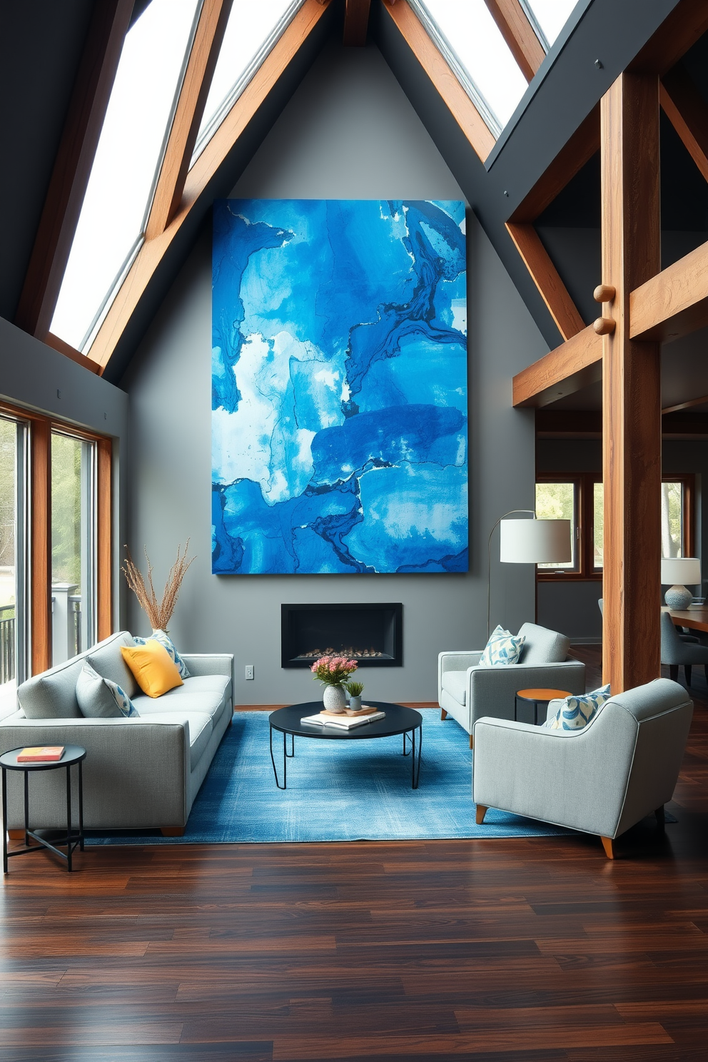 A stylish basement area featuring a large blue abstract painting that serves as a focal point on the wall. The space is accented with soft gray furnishings and warm wooden accents to create a cozy atmosphere. The flooring is a rich dark wood, complementing the blue tones in the artwork. Large windows allow natural light to flood the room, enhancing the vibrant colors and inviting a sense of openness.