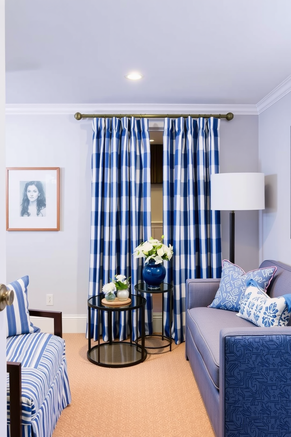 A stylish basement designed in shades of blue and white. The space features blue and white striped curtains that add a touch of flair and elegance.