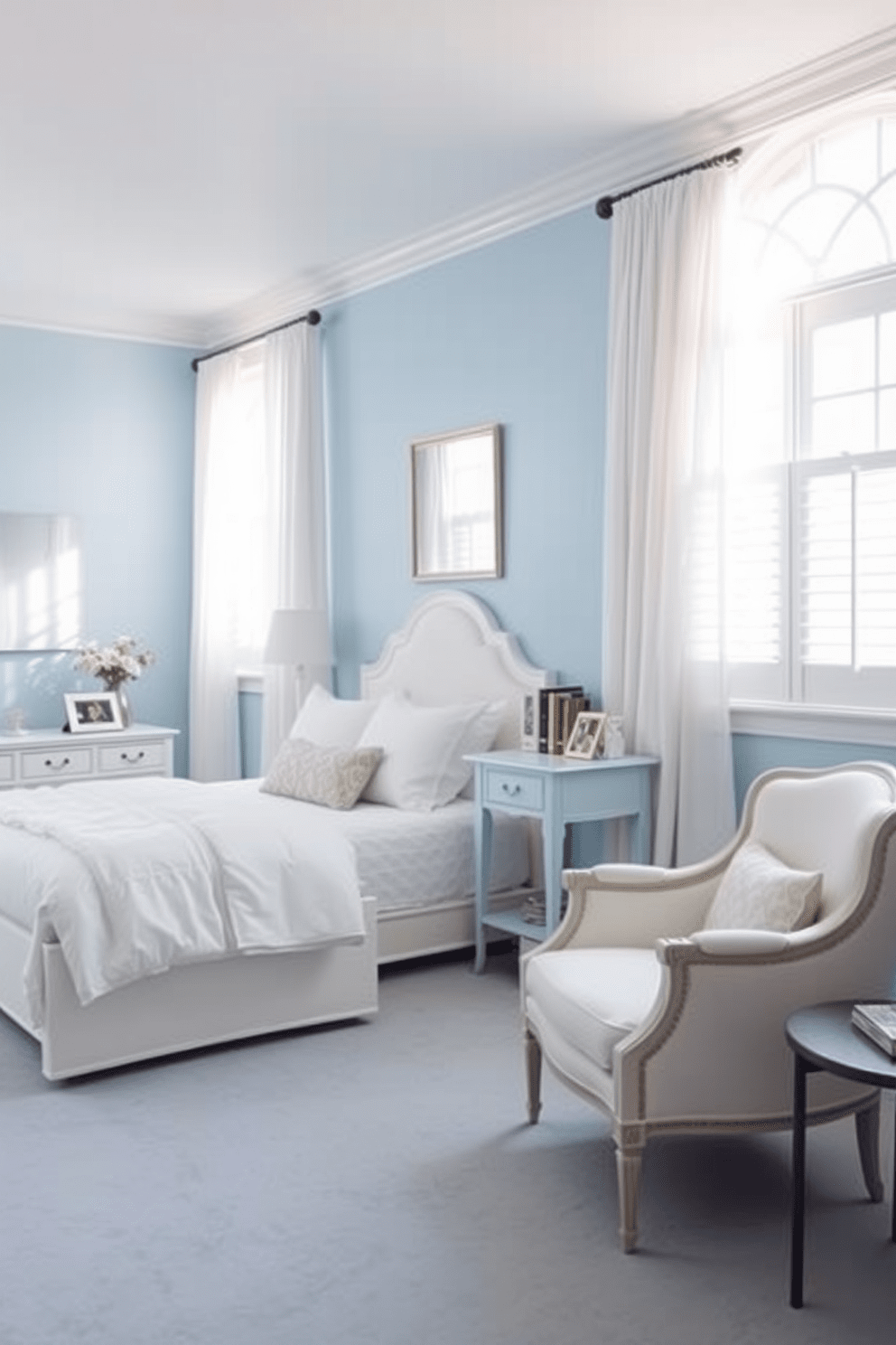 A serene blue bedroom featuring light blue walls that create a calming atmosphere. The room is furnished with elegant white furniture, including a plush bed with crisp white linens and a stylish nightstand. Natural light floods the space through large windows adorned with sheer white curtains. A cozy reading nook is set up in one corner with a comfortable white armchair and a small bookshelf.