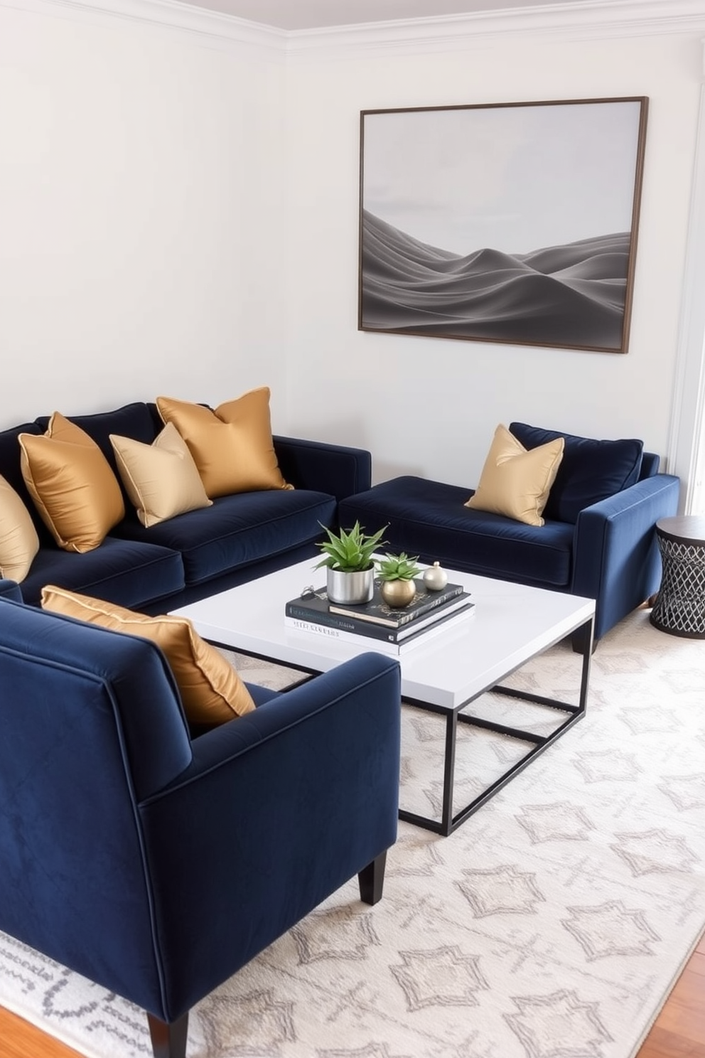 A cozy family room featuring a navy blue sofa adorned with gold decorative pillows. The walls are painted in a soft white hue, and a large area rug with subtle geometric patterns anchors the space. In the corner, a stylish armchair complements the sofa, creating a welcoming reading nook. A sleek coffee table sits at the center, topped with a few decorative books and a small potted plant.