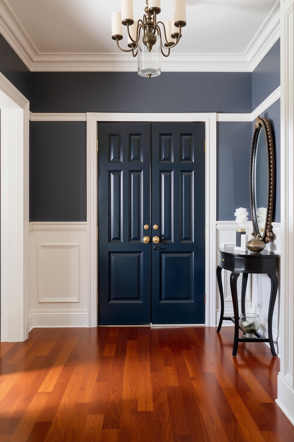 A dark blue door with a brass doorknob welcomes guests into a spacious foyer. The walls are adorned with elegant white wainscoting, and the floor features polished hardwood that complements the rich color of the door. A stylish console table sits against one wall, topped with a decorative mirror and a few tasteful accessories. Soft lighting from a chandelier above creates a warm and inviting atmosphere in the foyer.