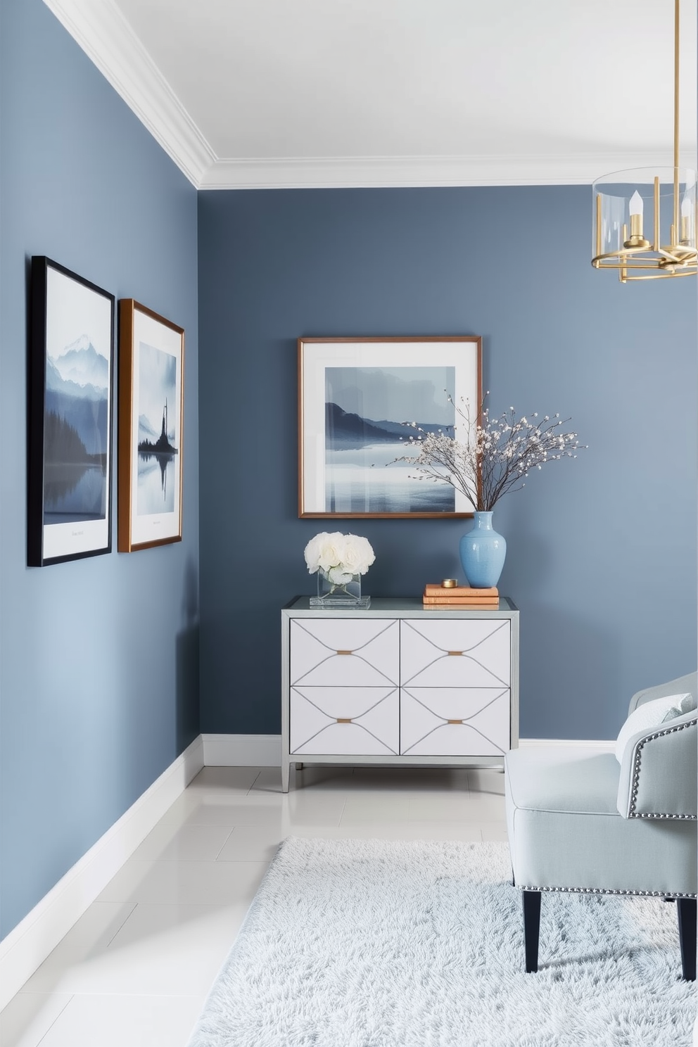 A serene foyer featuring muted blue art pieces elegantly displayed on the walls. The space is enhanced by a soft blue color palette, complemented by a stylish console table and a plush area rug.