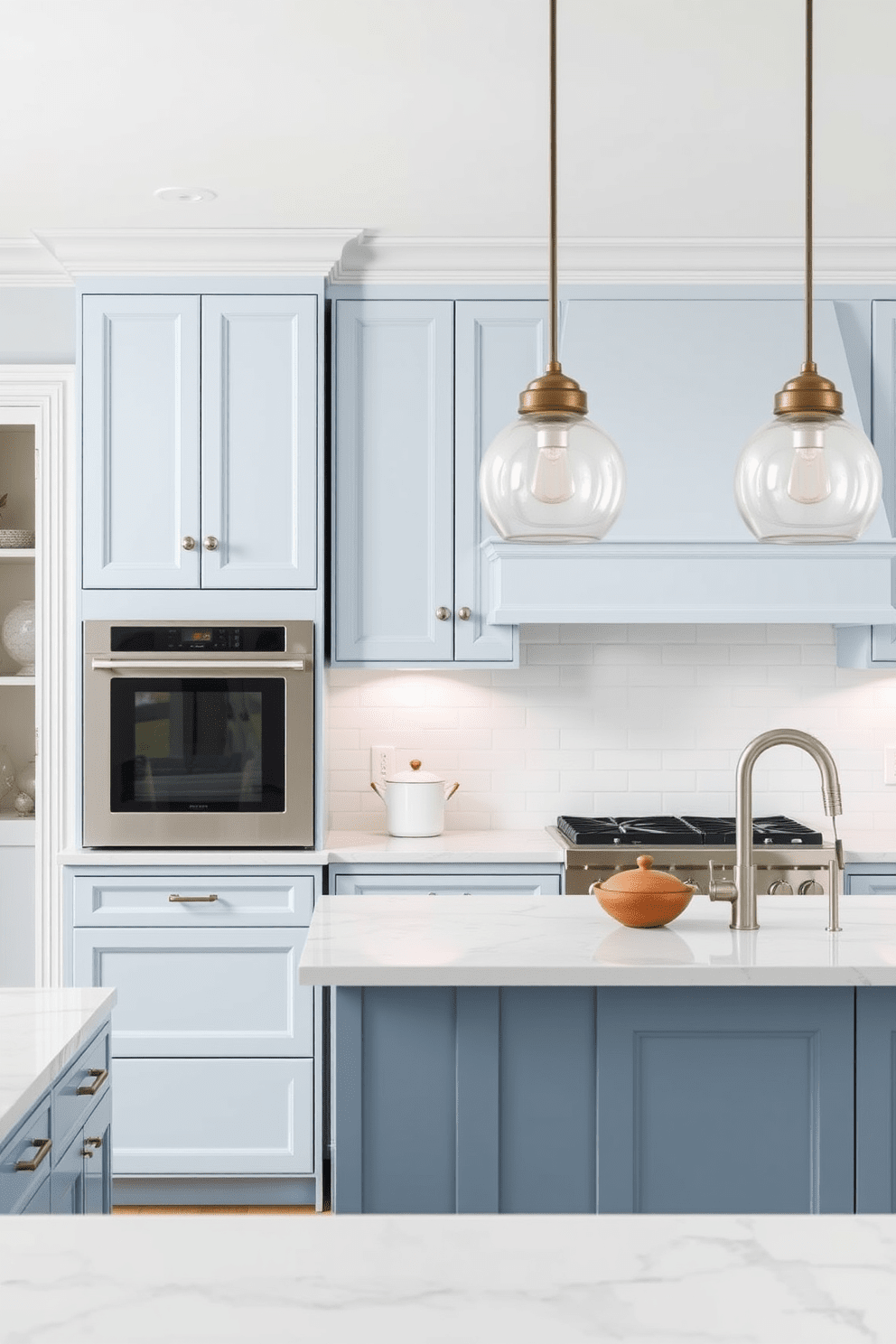 A serene kitchen space featuring soft blue cabinetry complemented by elegant white trim. The countertops are made of polished white quartz, and stylish pendant lights hang above a spacious island.