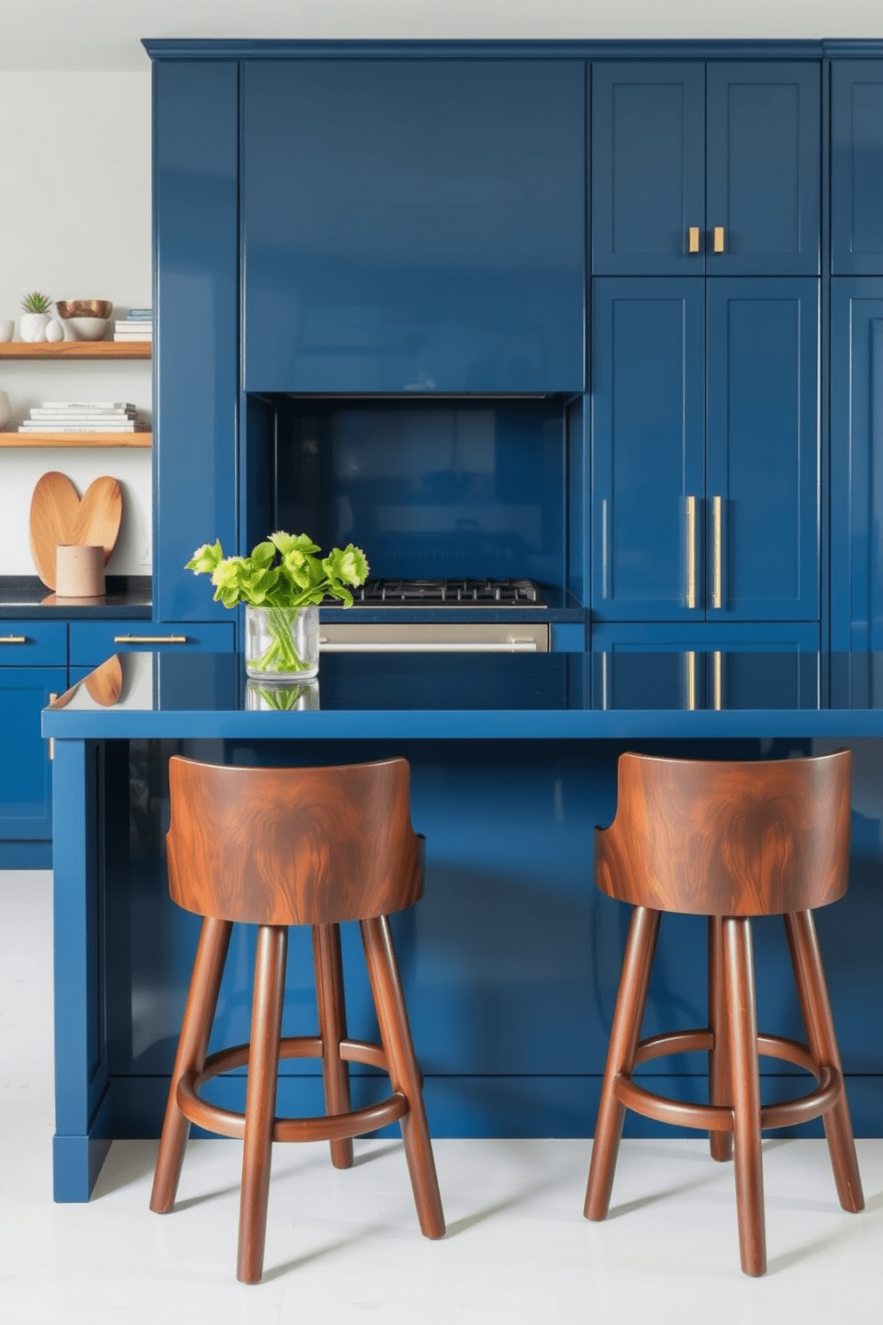 A rich blue kitchen island takes center stage, complemented by dark wood stools that add warmth and elegance. The cabinetry features a sleek design with a glossy finish, creating a modern yet inviting atmosphere.