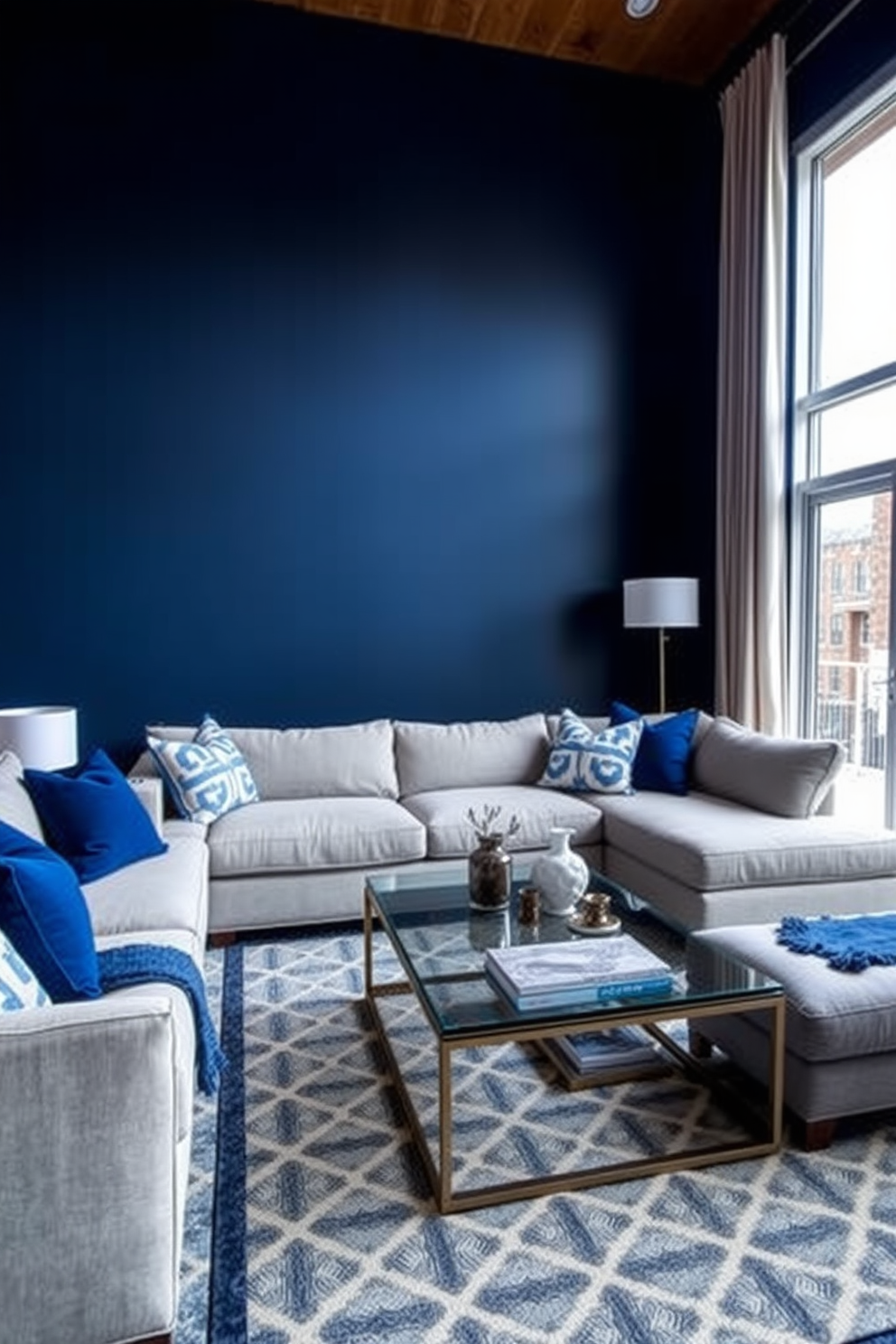 A striking accent wall painted in deep navy creates a bold focal point in the living room. The space features a plush sectional sofa in light gray, complemented by vibrant blue and white throw pillows. A sleek coffee table made of glass and metal sits in the center, surrounded by a cozy area rug with geometric patterns. Floor-to-ceiling windows allow natural light to flood the room, enhancing the rich color scheme.