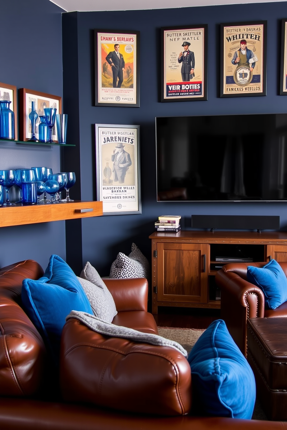 A stylish bar area featuring blue-tinted glassware arranged on a sleek wooden shelf. The backdrop is a deep navy wall adorned with framed vintage bar posters, creating a cozy yet sophisticated atmosphere. An inviting man cave designed with plush leather seating in rich brown tones. The space is accented with blue and gray throw pillows, and a large flat-screen TV is mounted above a rustic wooden media console.