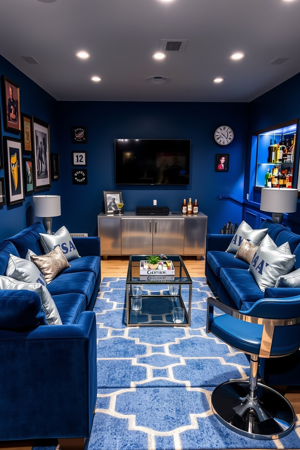 A cozy blue man cave featuring plush navy sofas and silver accent pillows. The walls are adorned with framed sports memorabilia and a large flat-screen TV is mounted above a sleek silver media console. Decor items include a modern blue area rug with geometric patterns and silver table lamps on either side of a stylish coffee table. A custom bar area showcases blue and silver bar stools, complemented by illuminated shelves displaying an array of spirits.