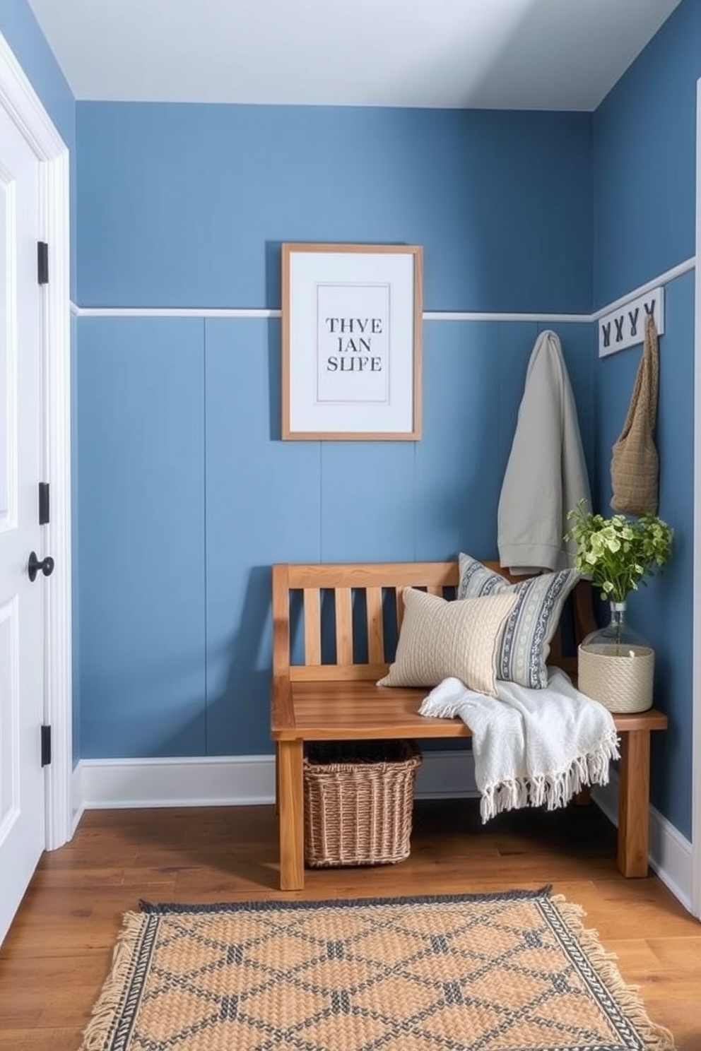 Cottage style blue mudroom with a cozy wooden bench against the wall. The walls are painted in a soft blue hue, complemented by white shiplap accents and a rustic woven rug on the floor.