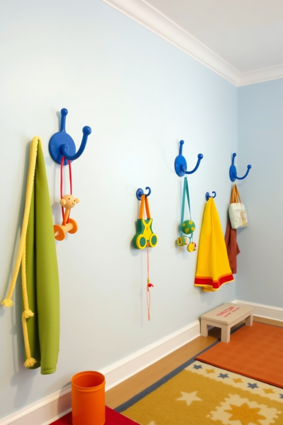 A playful playroom setting with blue wall hooks strategically placed for hanging toys. The walls are painted in a calming light blue, and colorful rugs add warmth to the space.