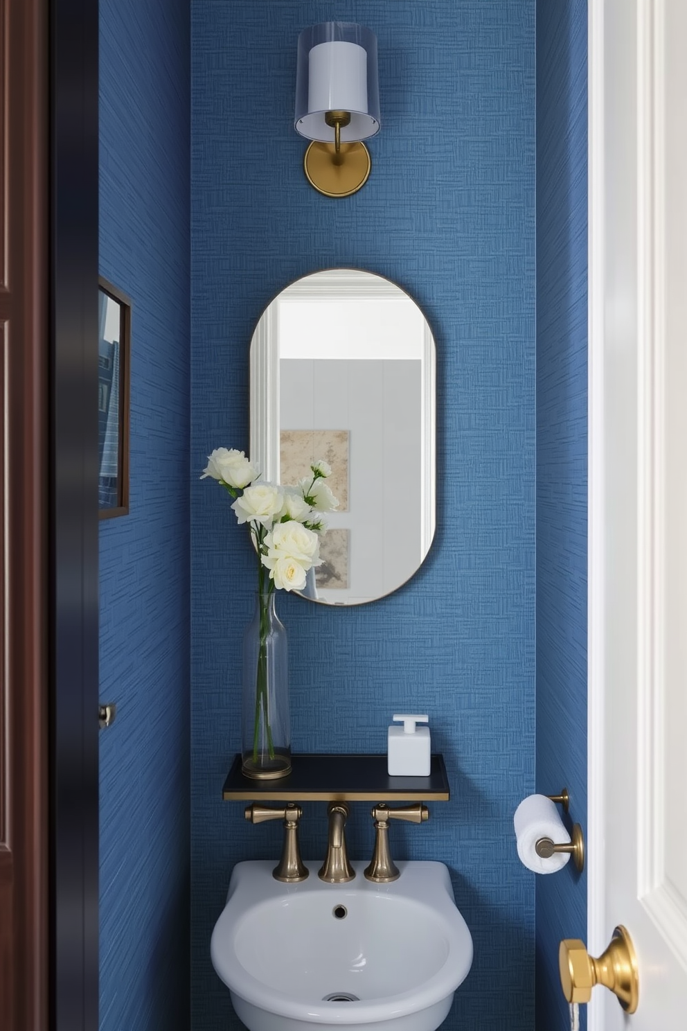 Textured blue wallpaper adds a rich layer of depth to the space. The powder room features elegant fixtures and complementary accessories to enhance the overall design.