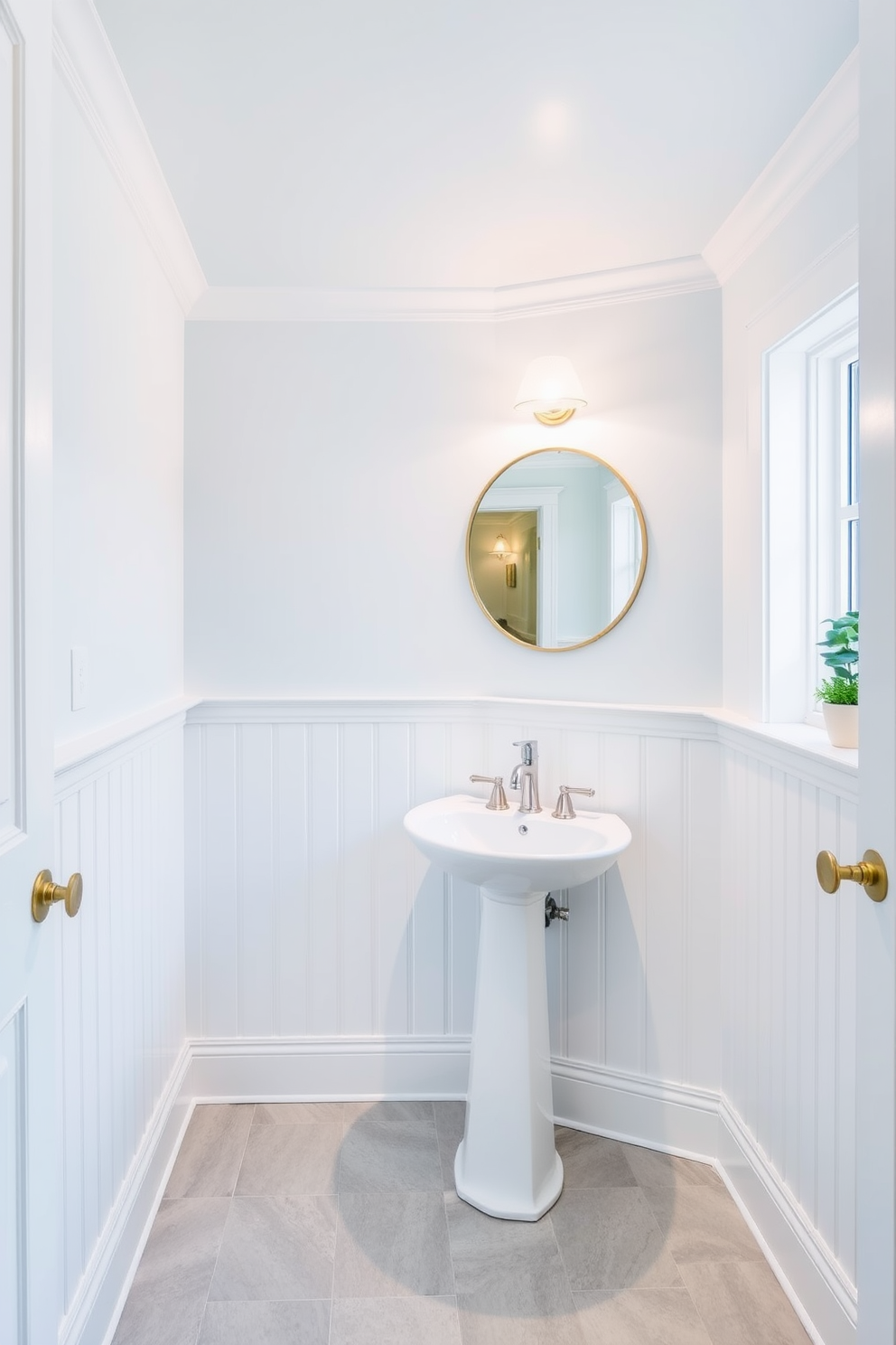 A pale blue ceiling creates an airy and serene atmosphere in the powder room. The walls are adorned with delicate white wainscoting that complements the ceiling beautifully. A sleek white pedestal sink is placed against one wall, topped with a modern chrome faucet. A round mirror with a thin gold frame hangs above the sink, reflecting the soft light from a stylish wall sconce. The floor features light gray tiles with a subtle texture, enhancing the room's elegance. A small potted plant sits on the windowsill, adding a touch of greenery to the space.