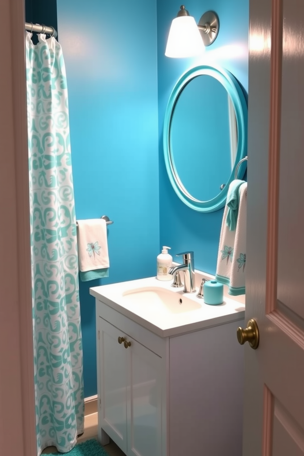 A vibrant blue powder room features walls painted in a rich turquoise hue that instantly energizes the space. Complementing the walls, playful turquoise accessories such as a patterned shower curtain and decorative towels add a fun and whimsical touch. The room includes a sleek white vanity topped with a polished chrome faucet, providing a modern contrast to the bold color scheme. A round mirror with a turquoise frame is mounted above the vanity, reflecting the lively atmosphere and enhancing the overall brightness of the room.