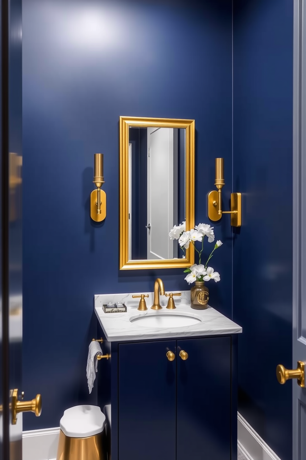 A sophisticated powder room featuring a striking blue and gold color palette. The walls are painted in a deep navy blue, while gold accents adorn the fixtures and decor. A sleek vanity with a white marble top sits against the wall, complemented by a gold-framed mirror above it. Elegant gold sconces provide soft lighting on either side of the mirror, enhancing the luxurious ambiance.