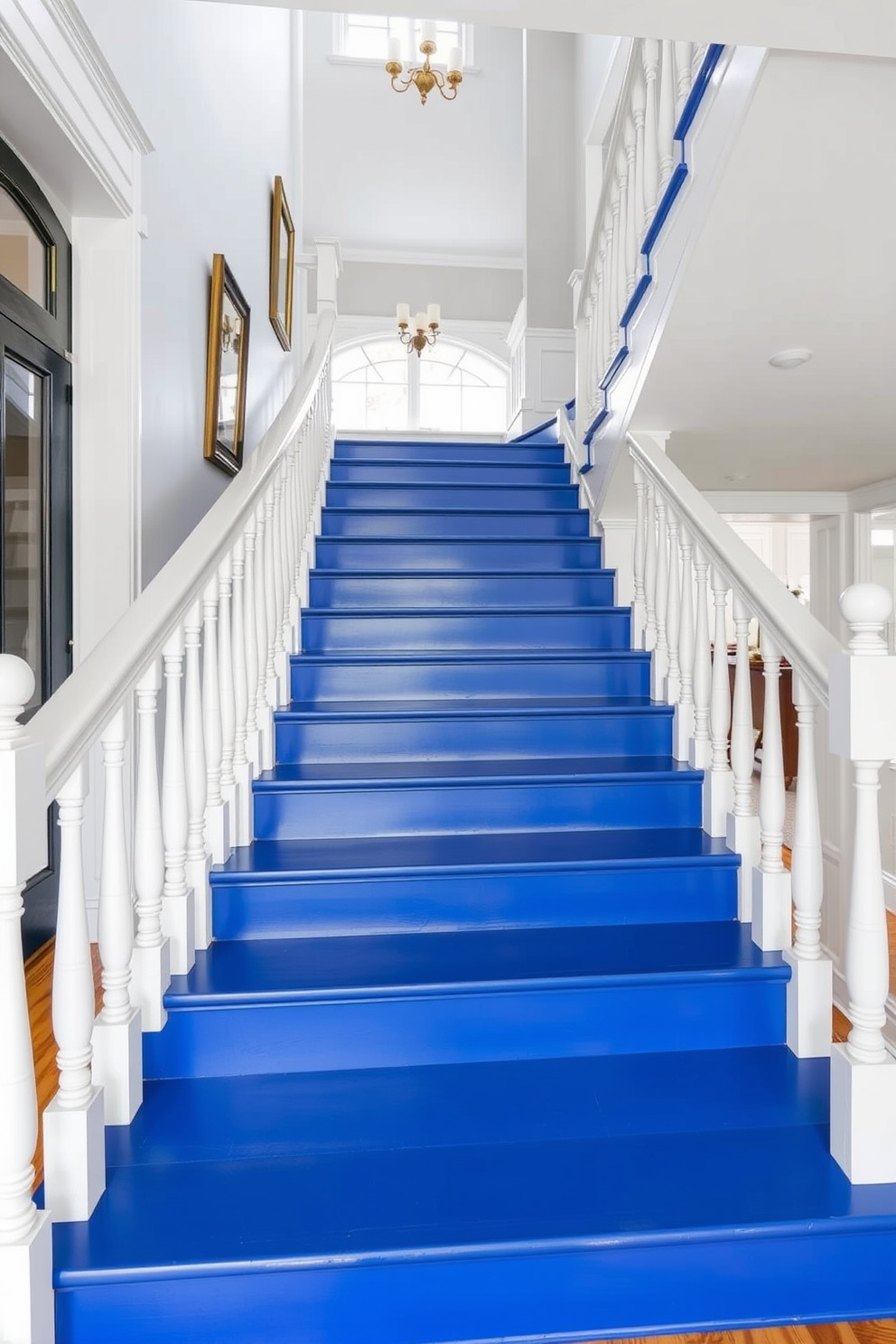 A stunning staircase features cobalt blue steps that create a bold statement in the entryway. The white balusters provide a striking contrast, adding elegance and charm to the overall design.