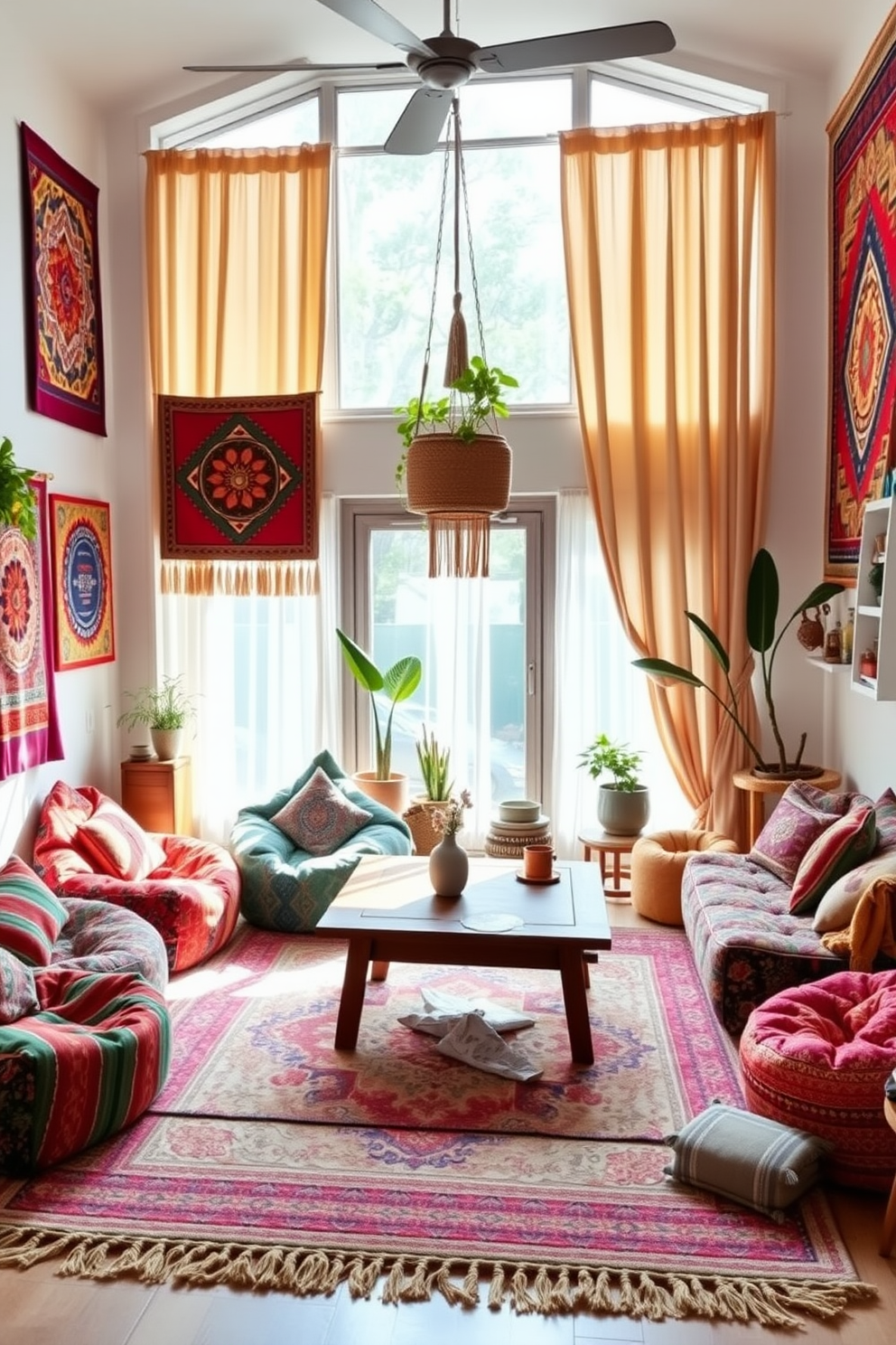 A cozy boho chic living room features colorful patterned bean bags arranged around a low wooden coffee table. The walls are adorned with woven tapestries and the floor is covered with a soft area rug that complements the vibrant colors of the seating. Natural light floods the space through large windows draped with sheer curtains, creating a warm and inviting atmosphere. Potted plants and eclectic decor items add to the relaxed vibe, making it the perfect spot for casual gatherings.