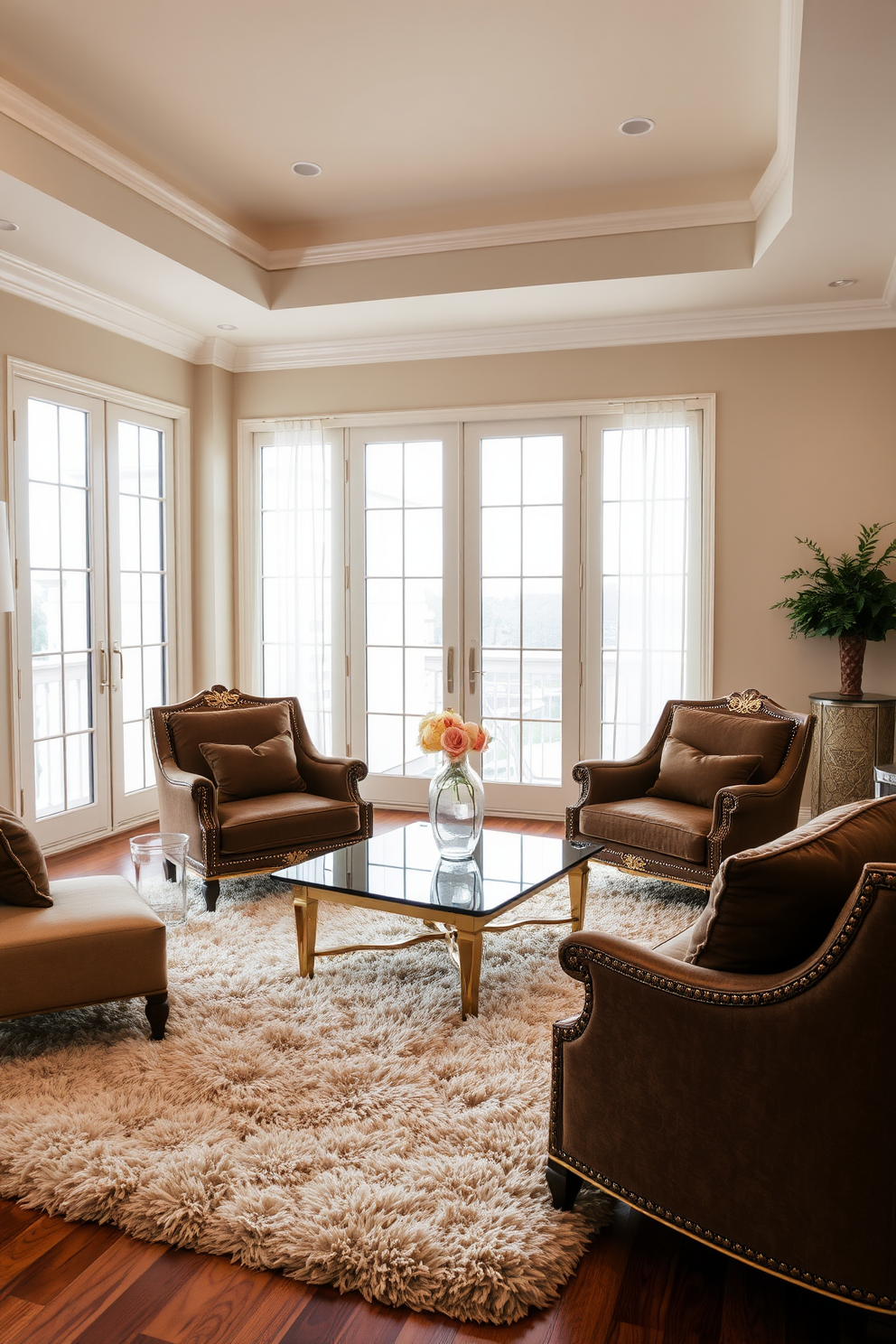 Elegant brown armchairs with gold accents are positioned around a sleek glass coffee table. The walls are adorned with soft beige tones, creating a warm and inviting atmosphere in the living room. Rich textures are introduced through a plush area rug that complements the armchairs. Large windows allow natural light to flood the space, highlighting the luxurious details of the decor.