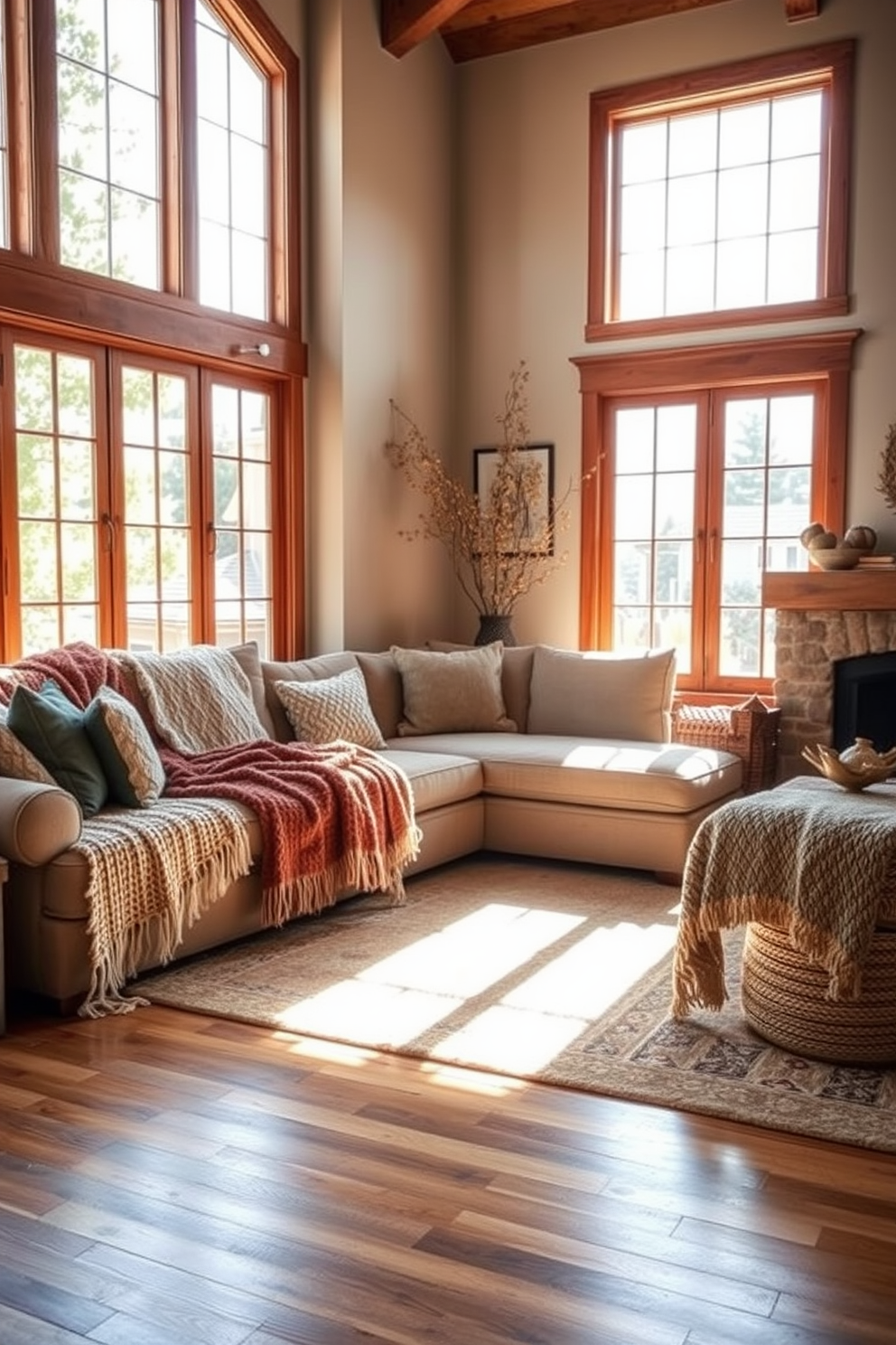 A cozy California living room featuring textured throw blankets draped over a plush sectional sofa. Sunlight pours in through large windows, illuminating the warm wooden floors and accentuating the earthy tones of the decor.