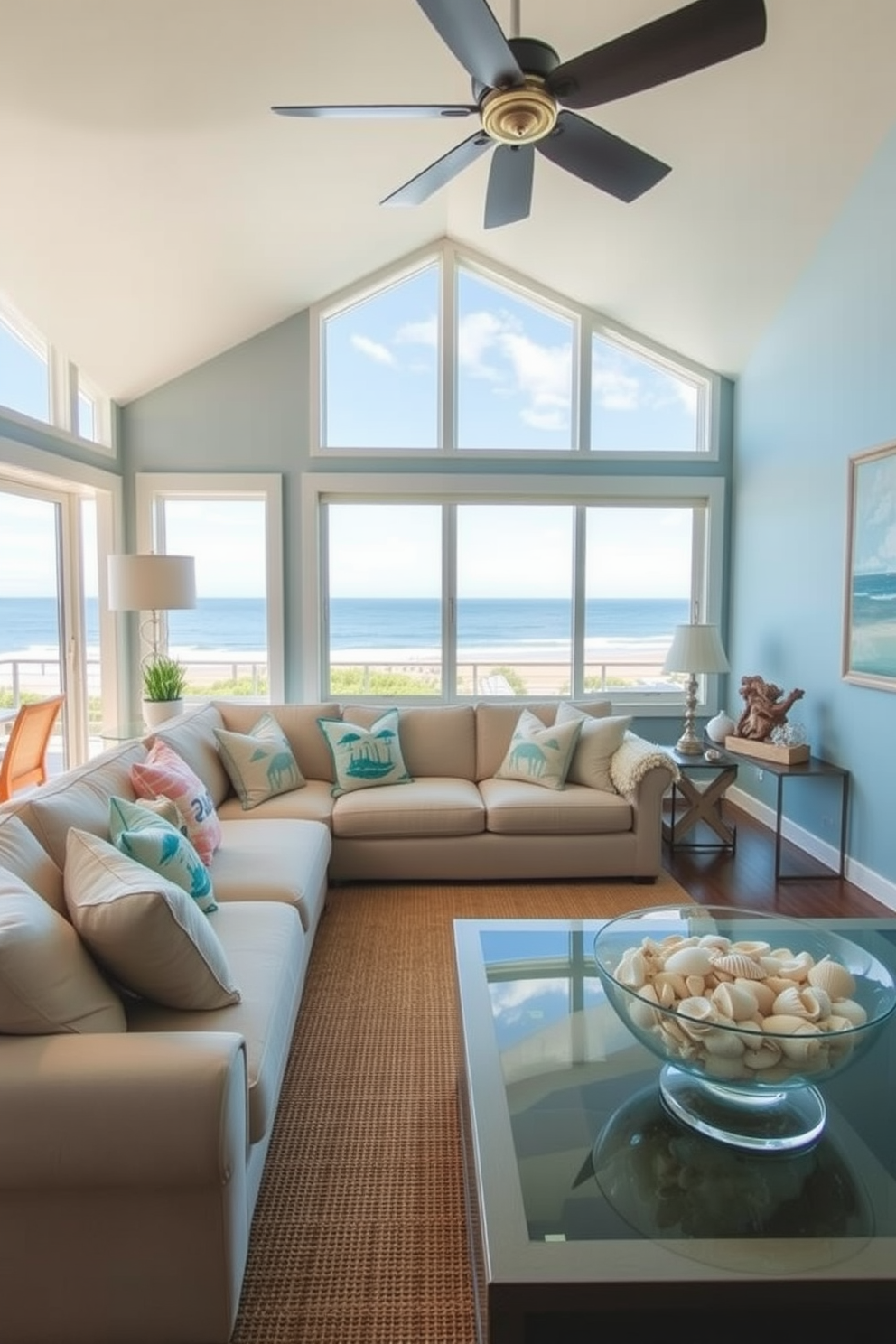 A bright and airy California living room features a soft beige sectional sofa adorned with ocean-themed throw pillows. Large windows allow natural light to flood the space, showcasing a stunning view of the coastline. The walls are painted a light blue, reminiscent of the sky, while a jute area rug adds texture underfoot. Decor elements include driftwood accents, a collection of seashells displayed in a glass bowl, and coastal artwork that captures the essence of seaside living.