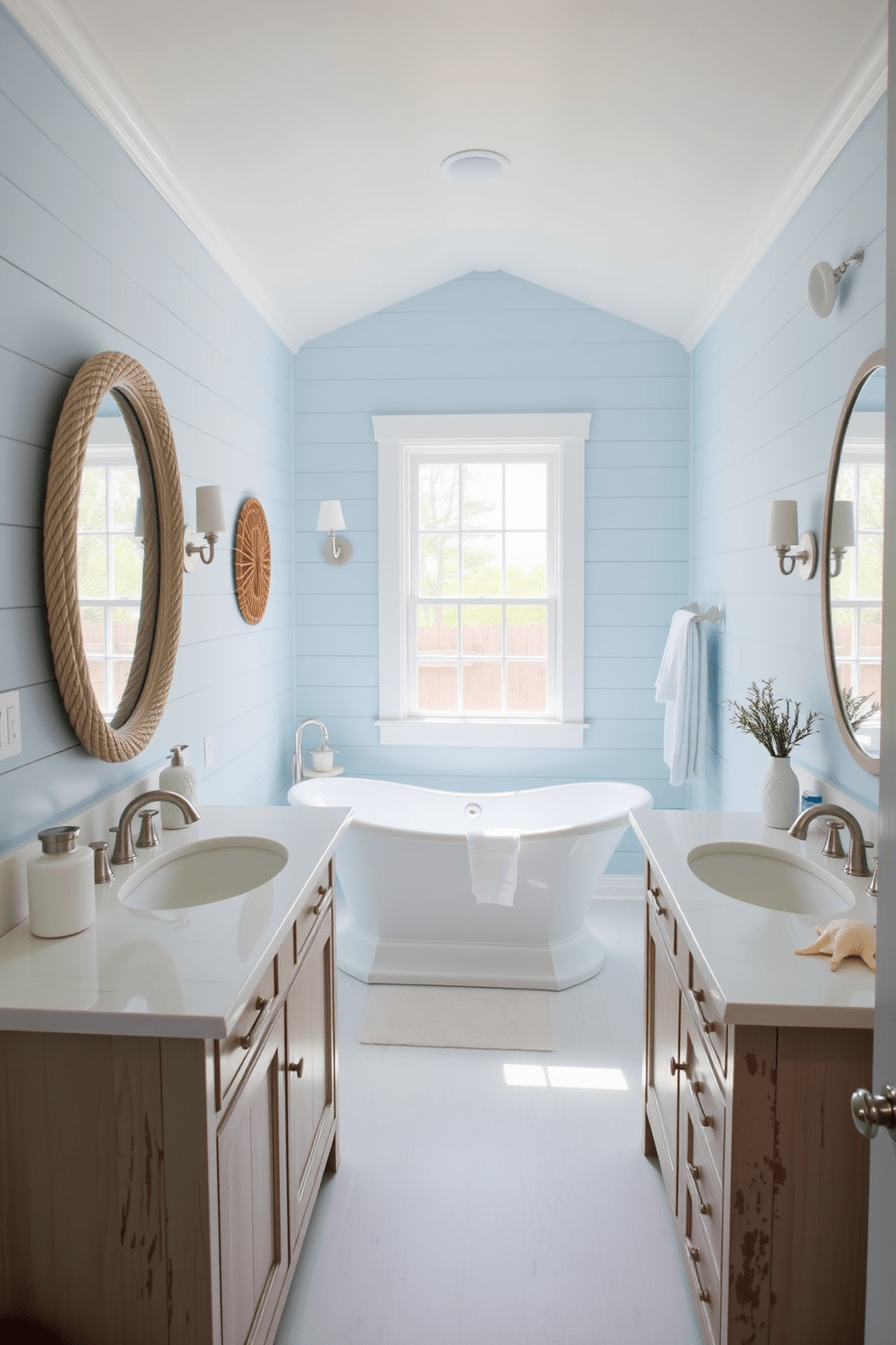 Light blue shiplap walls create a serene atmosphere in the coastal bathroom. The space features a freestanding soaking tub positioned beneath a large window, allowing natural light to flood in. A driftwood vanity with a white quartz countertop complements the coastal theme. Nautical accents like a rope mirror and seashell decor enhance the tranquil vibe of the room.