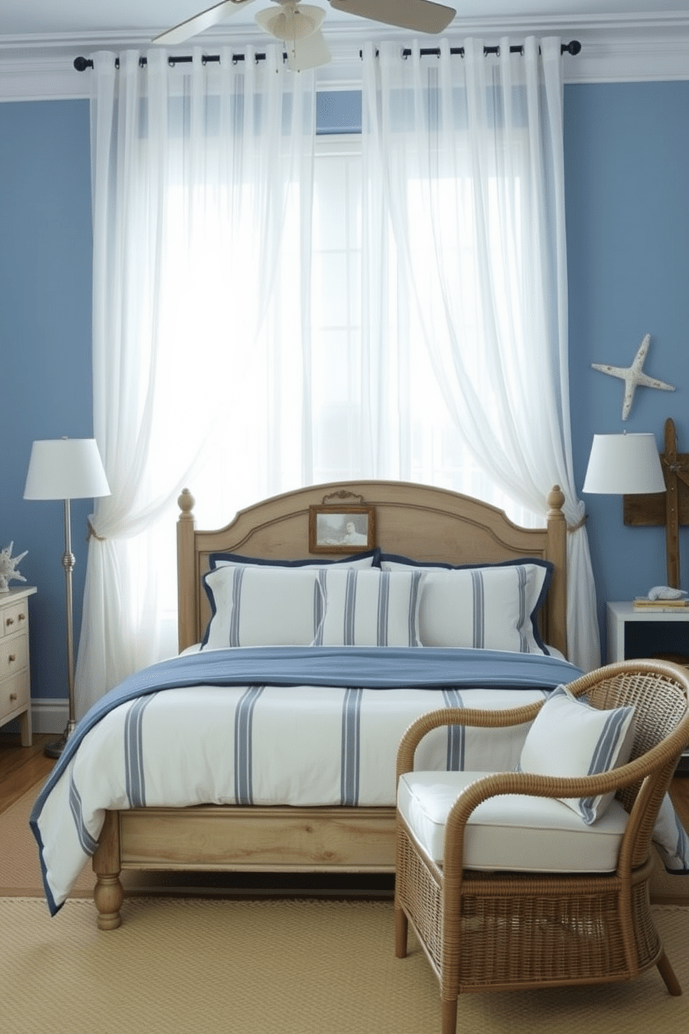 A coastal bedroom setting with light sheer curtains that flutter gently in the breeze. The walls are painted in a soft blue hue, while the bedding features a mix of white and navy stripes for a nautical touch. A wooden bed frame with a weathered finish anchors the room, complemented by a cozy seating area with wicker chairs. Decorative elements include seashells and driftwood accents, enhancing the relaxed coastal vibe.