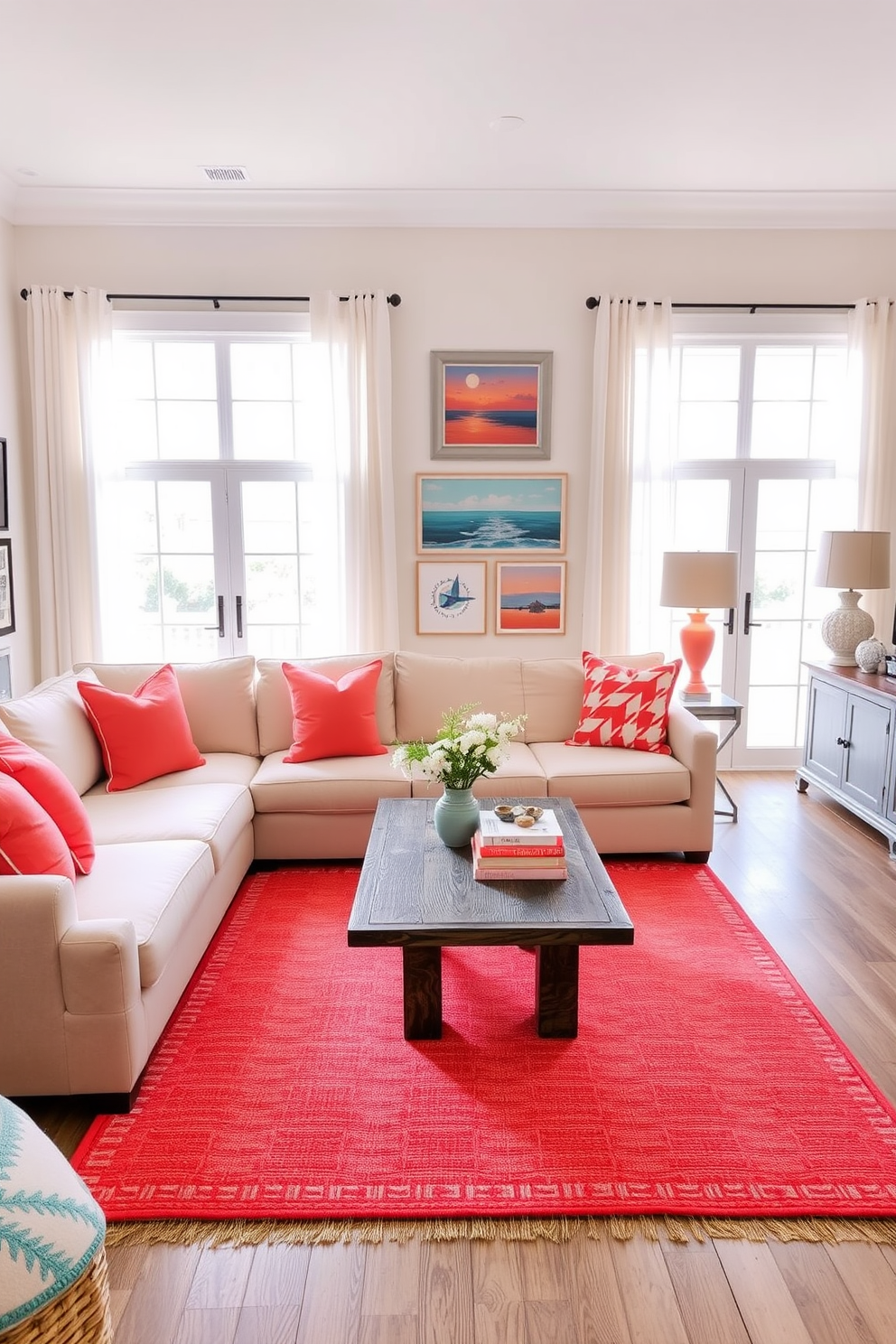 A coastal living room featuring bright coral accents throughout the space. The furniture includes a light beige sectional sofa adorned with vibrant coral throw pillows and a matching coral area rug under a rustic coffee table. Large windows allow natural light to flood the room, framed by sheer white curtains that gently billow in the breeze. A collection of coastal-themed artwork in shades of blue and coral adorns the walls, enhancing the beachy vibe of the room.