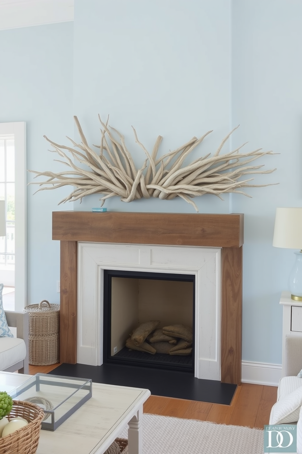 A serene coastal living room featuring a mantelpiece adorned with decorative driftwood. The space is filled with soft, natural light, highlighting light blue walls and whitewashed wooden furniture.