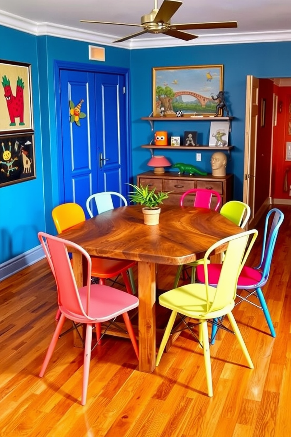 A vibrant dining area featuring a mix of eclectic dining chairs in various colors and styles. The table is a rustic wooden piece that contrasts beautifully with the modern aesthetic of the chairs. The walls are adorned with playful artwork and the flooring is a warm hardwood that adds coziness to the space. A small potted plant sits on the table, bringing a touch of greenery to the lively atmosphere.