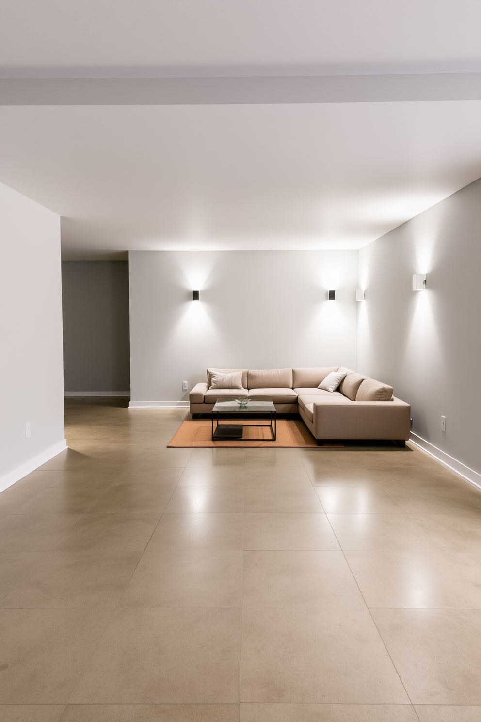 A sleek concrete floor extends throughout the modern basement, providing a minimalist and industrial aesthetic. The walls are painted in a light gray tone, enhancing the spacious feel of the area while allowing for versatile decor options. In one corner, a cozy seating arrangement features a low-profile sectional sofa paired with a glass coffee table. Ambient lighting fixtures are strategically placed to create a warm atmosphere, perfect for relaxation or entertaining guests.