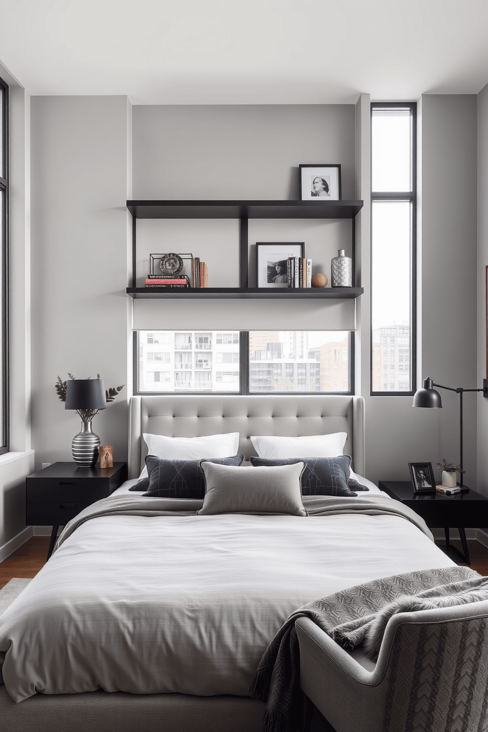 A modern condo bedroom featuring a plush king-sized bed with a tufted headboard. The walls are painted in a soft gray, and large windows allow natural light to fill the space. Floating shelves are mounted above a sleek nightstand, displaying curated decorative items and books. A cozy reading nook is created with a stylish armchair and a small side table in the corner.